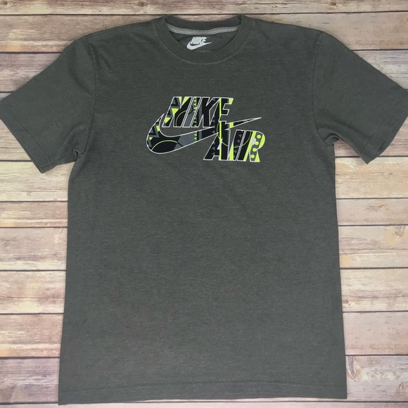 green and gray nike shirt